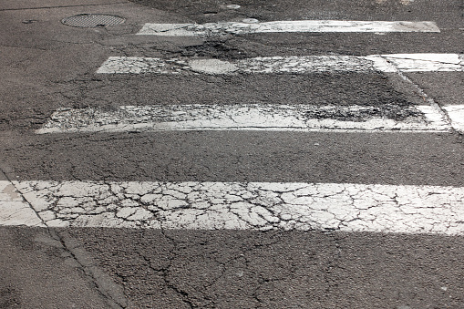 cracked tarmac road crossing