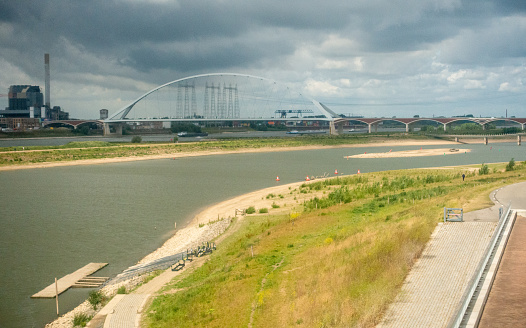 the Rhine (waal) made bigger and bridge with Demolished power plant in Nijmegen