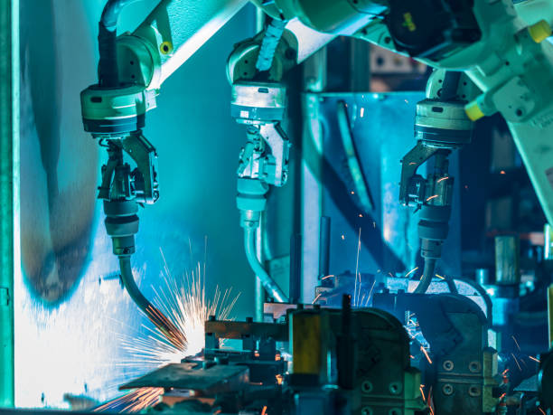 istock Welding robots movement in a car factory 1249817706