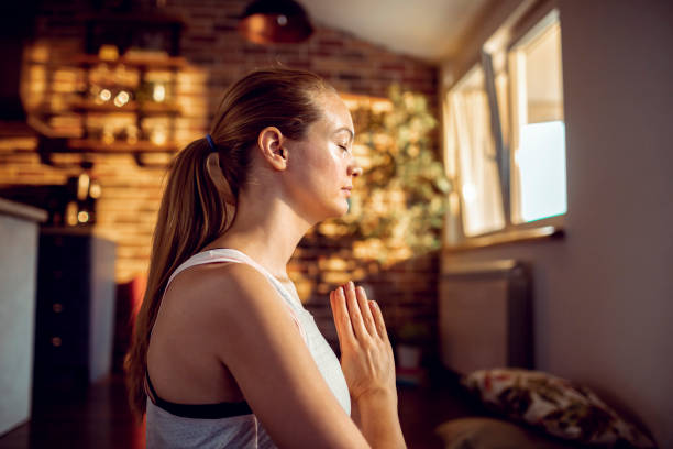 istock Young Woman doing Yoga at Home 1249820036