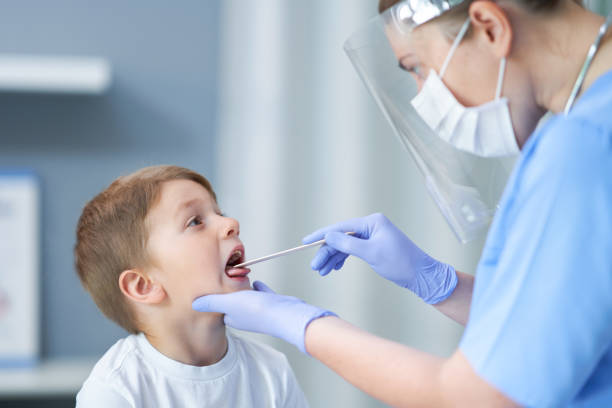 Portrait of adorable little boy having doctor's appointment stock photo