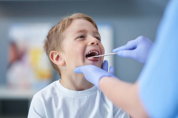 Portrait of adorable little boy having doctor's appointment stock photo