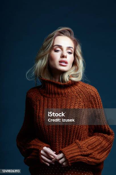 Fashion Portrait Of Blond Hair Woman In Brown Sweater Stock Photo - Download Image Now