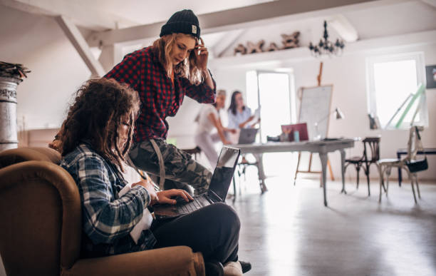 istock Team of young designers  cooperating in the office 1249826711