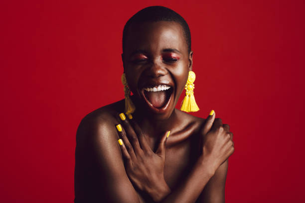 istock Cheerful fashion model with colorful makeup in studio 1249827685