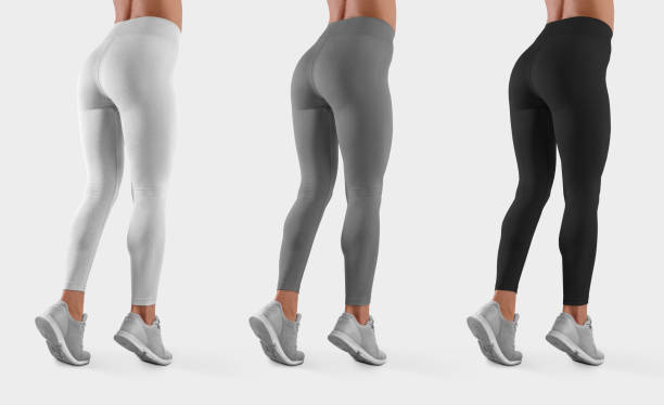 Mockup of sportswear on a fit girl standing on toes in sneakers, side and back, for design presentation. Mockup of sportswear on a fit girl standing on toes in sneakers, side and back, for design presentation. Template of white, gray, black leggings on a slim model, isolated on background. Set of pants leggings stock pictures, royalty-free photos & images