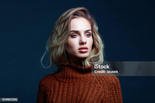 Headshot Of Blond Hair Woman In Brown Sweater Stock Photo - Download Image Now - One Woman Only, Women, 20-29 Years
