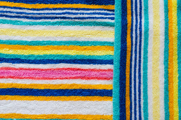 istock Multi-colored striped beach towel close-up. 1249832077