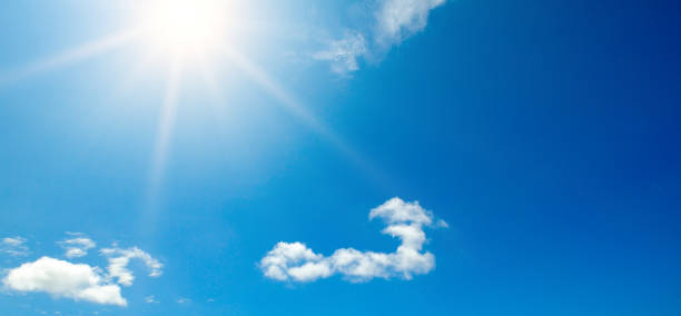 istock Couds in the blue sky. Bright midday sun illuminates the space. 1249835572