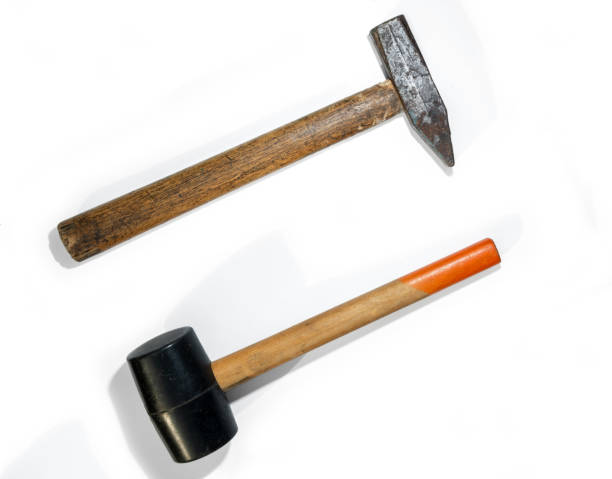 two hammers. rubber and steel hammers - balance symmetry comparison old imagens e fotografias de stock