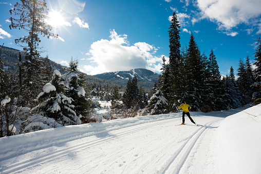 Unrecognizable skiers on ski resort