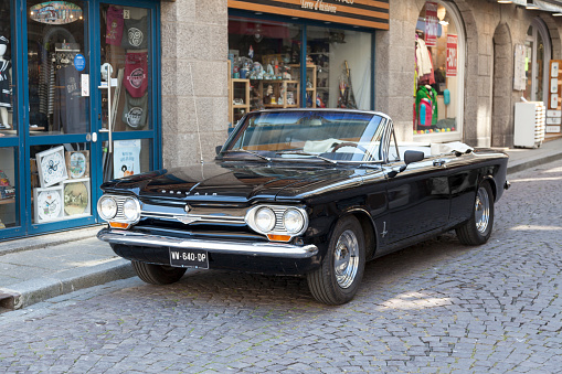 Saint-Malo, France - June 02 2020: 1964 Chevrolet Corvair Monza Convertible parked in the street.