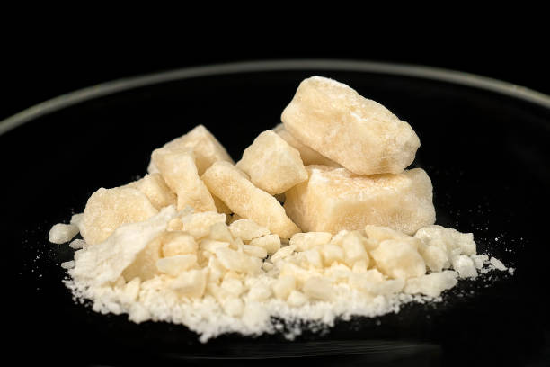 Crack cocaine street dosage Crack, a type of drug obtained through chemical processes from cocaine. Amazing substance in small pieces. Crack is produced by dissolving powdered cocaine in a mixture of water and ammonia or sodium bicarbonate (baking soda). The mixture is boiled until a solid substance forms. The solid is removed from the liquid, dried, and then broken into the chunks (rocks) that are sold as crack cocaine. The name "crack" refers to the sound generated during its manufacture and when smoked. Street names include: rock, hard, iron, cavvy, base, or just crack. crack cocaine stock pictures, royalty-free photos & images
