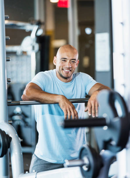 istock Hispanic man working out at gym, resting 1249842500