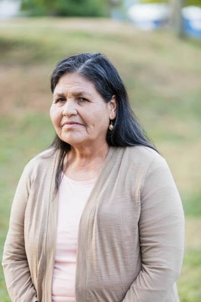 istock Senior Hispanic woman looking at camera, serious 1249844353