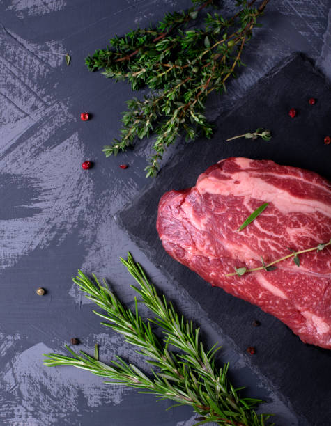 istock Raw marbled beef steak, herbs and spices 1249846238