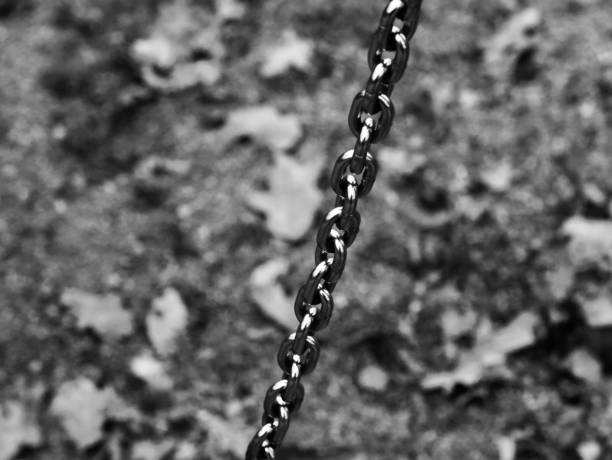 Metallic chains isolated black and white photo