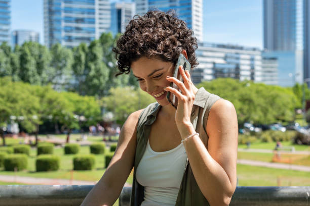 istock A beautiful woman using her smartphone outdoors. 1249850551