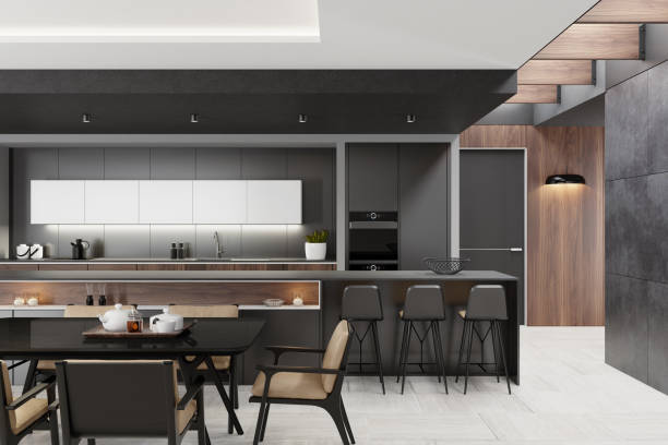 istock Luxurious matte black minimalist kitchen interior with long island table 1249851943