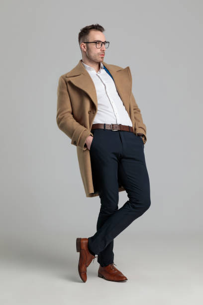 istock smartcasual man wearing glasses and long coat 1249855293