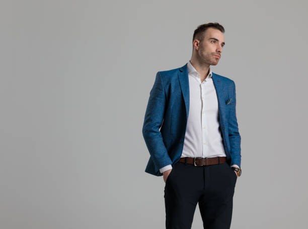 istock attractive young fashion model holding hands in pockets 1249856051