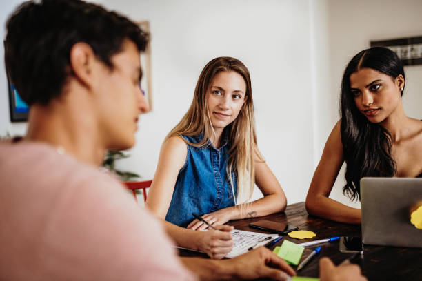 istock Millennial Latin business people working in team 1249858007