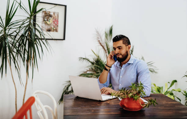 istock Handsome businessman with beard and shirt working from home 1249858009