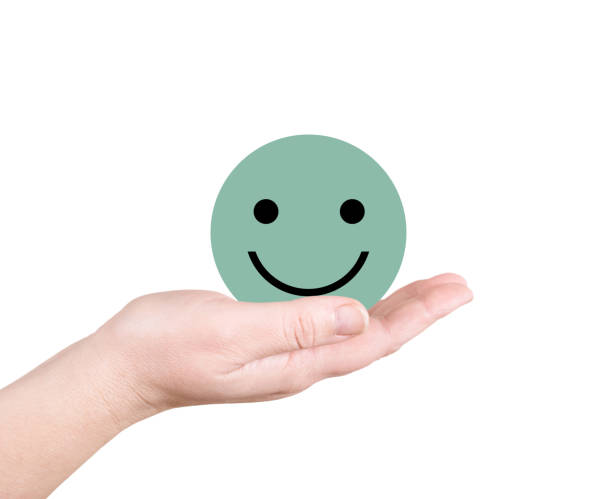 istock Green smiley on the palm 1249862138