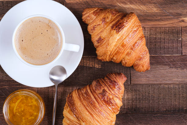 istock Cap coffee cappuccino and two croissant with jam 1249864473