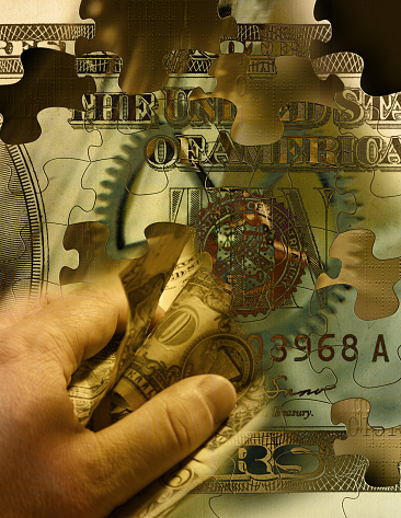 Dollar bill in human hand
