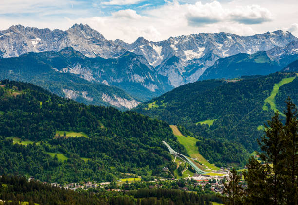 What a view of Garmisch-Partenkirchen with its Alps Majestically circle the Alps Garmisch-Partenkirchen round the world travel stock pictures, royalty-free photos & images