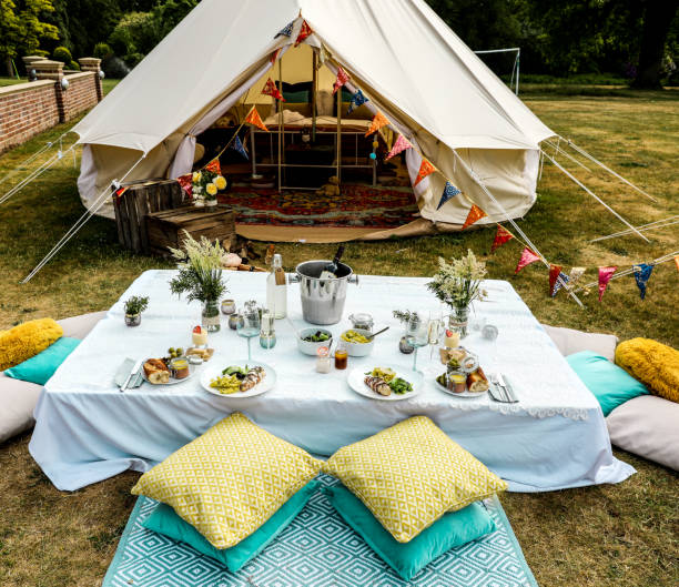 Glamping picnic table Glamping - bell tent - picnic table glamping photos stock pictures, royalty-free photos & images