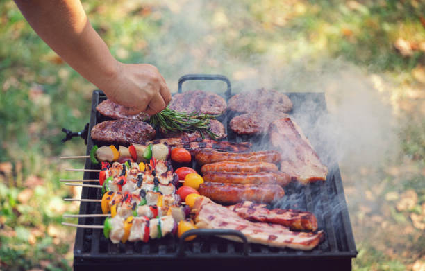 istock Young woman preparing barbecue in the backyard 1249868032