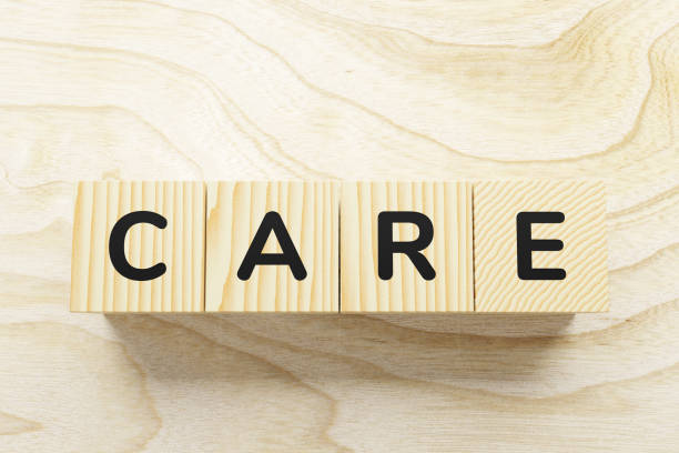 istock Care word written in wooden blocks. 1249868395
