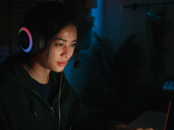 istock Young man playing video game inside a room at home. 1249868509