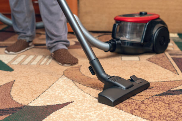 istock Housework, a man cleaning the floor with a vacuum cleaner 1249868734
