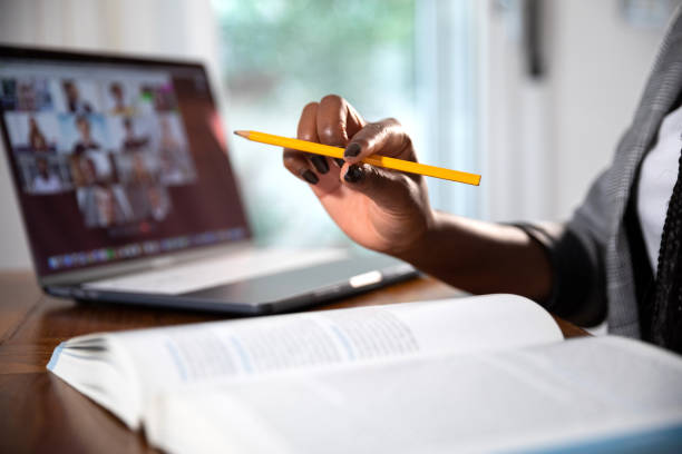 istock Woman learning and teaching homeschooling in video conference 1249870758