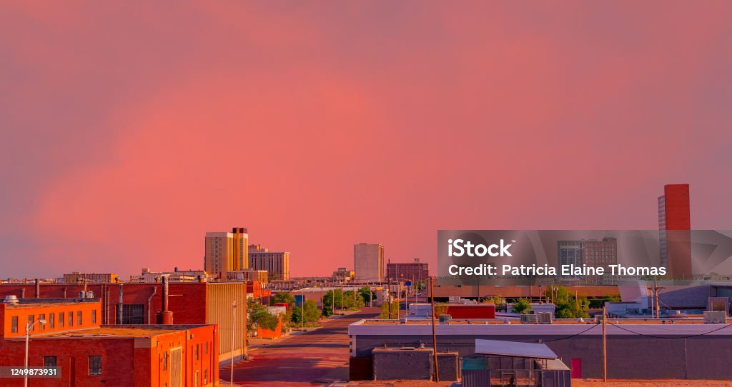 A brilliant sunset colors downtown Lubbock, Texas Looking down at the downtown district with a brilliant sunset creating color everywhere in Lubbock, Texas. Lubbock Stock Photo