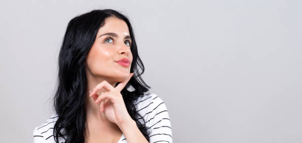 istock Young woman in a thoughtful pose 1249876044