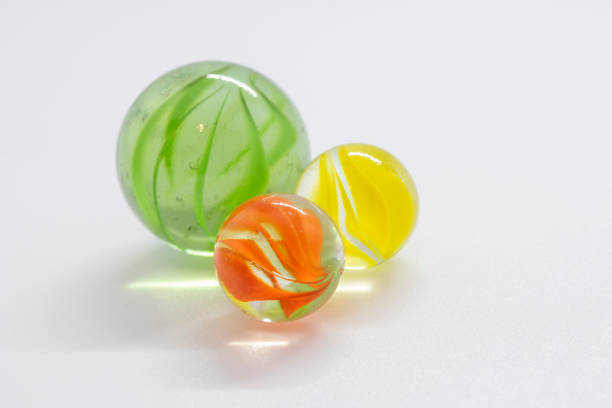 istock Colourful toy marbles against a white background 1249878635