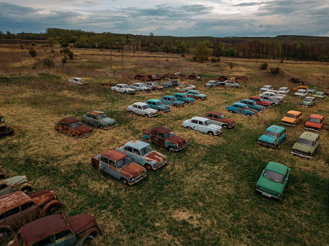 Old rusty abandoned retro cars, aerial view.