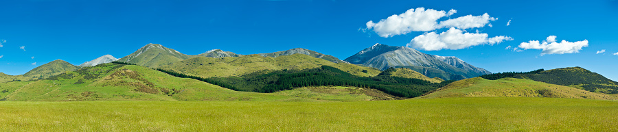 A multi photo panorama of the Grand Teton Mountain Range.