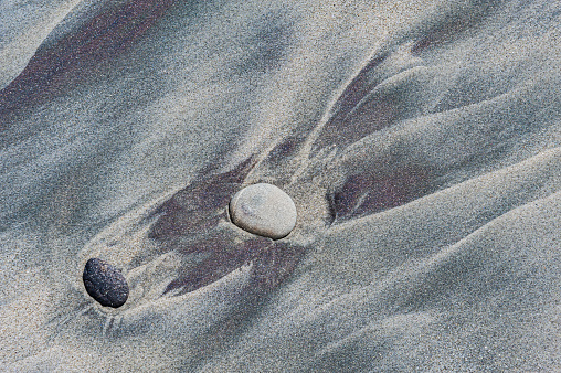 Beach patterns in the sand of the beach near Greymouth on the South Island of Zealand.