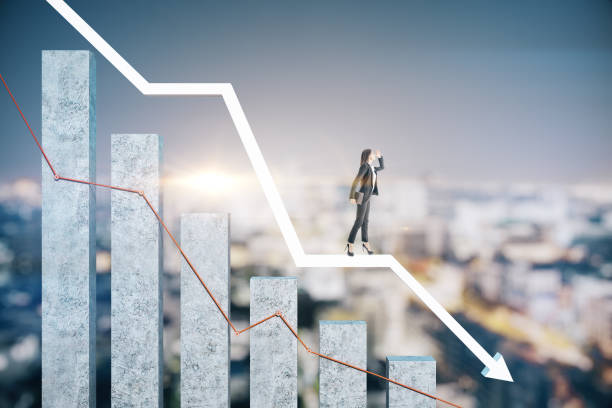 istock Businesswoman standing on falling business chart 1249880664