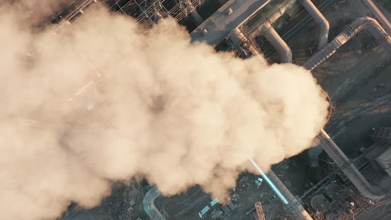 Aerial view. Pipes Throwing Smoke in the Sky