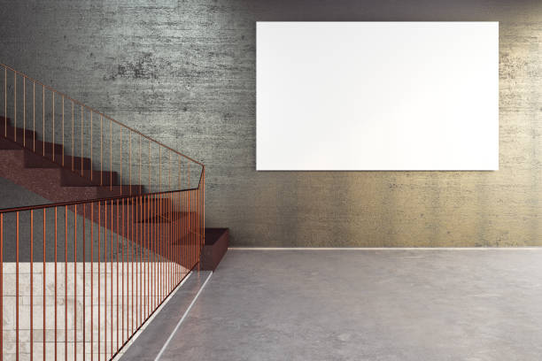 istock Concrete stairs in office building with empty banner on wall. 1249882378