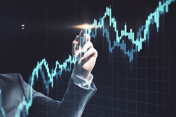 istock Businessman hand drawing gloving stock chart. 1249882746