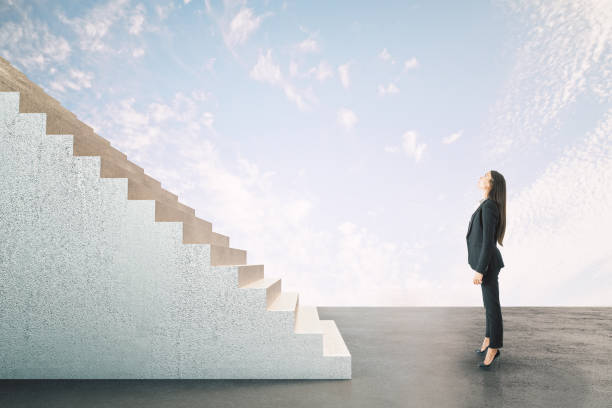 istock Businesswoman looking on abstract stairs 1249882825