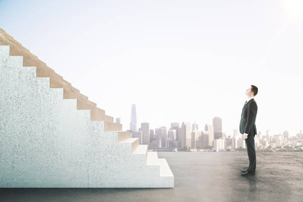 istock Businessman looking on abstract stairs 1249883484