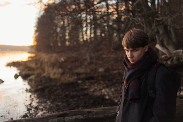 istock Portrait of a young man walking in forest alone 1249883530